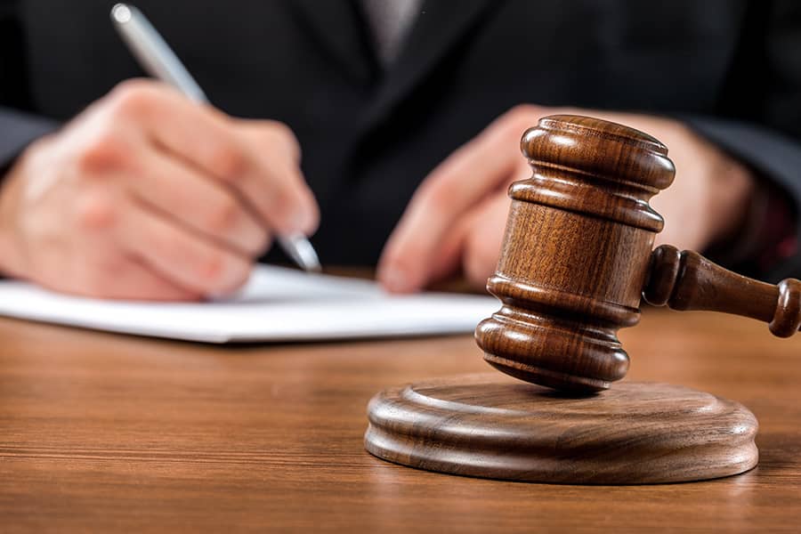 Gavel on a table symbolising legal compliance in South Africa’s HSE regulations.